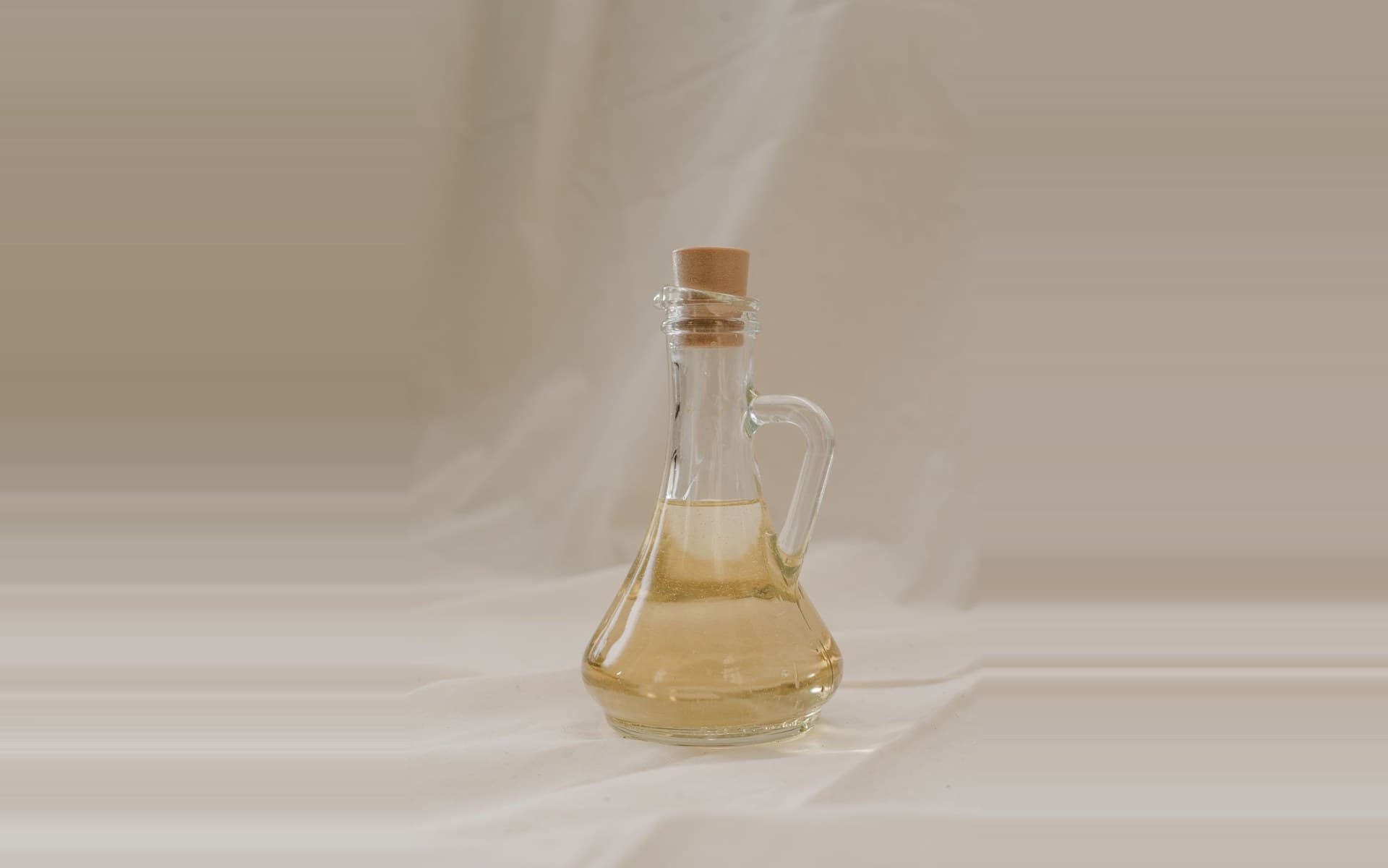 A bottle of golden cold-pressed macadamia oil